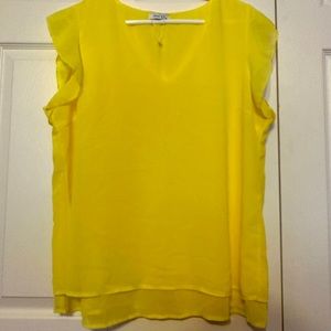 Brand new yellow blouse with shear sleeves.